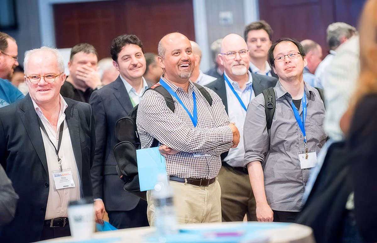 Group of people laughing and engaging at a corporate event in Boston.