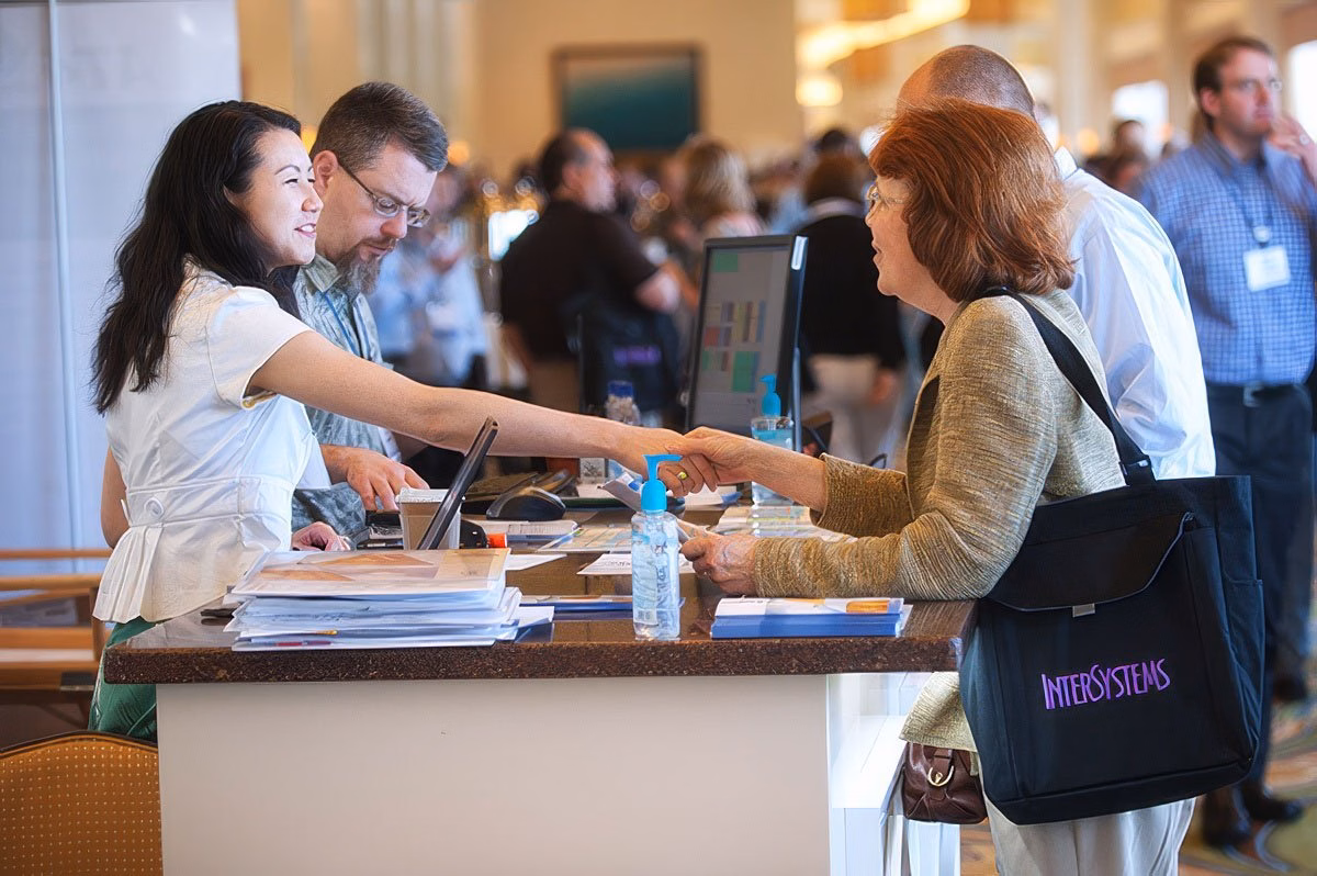 Corporate photographer Boston capturing an engaging interaction at a reception desk.
