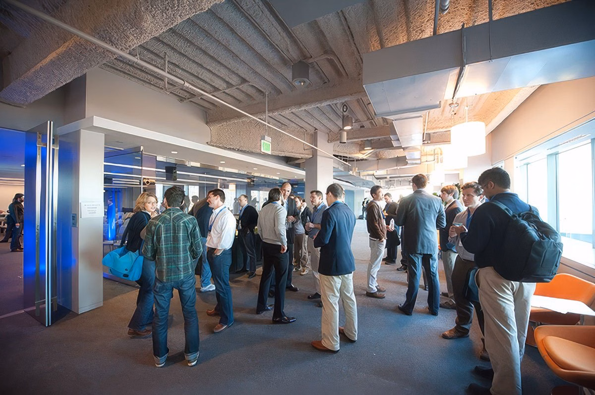 Group of people networking at a corporate event in Boston.
