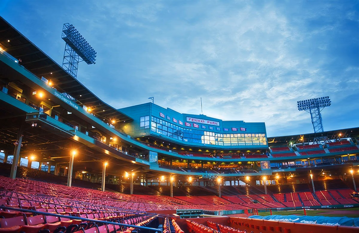 Fenway Park in Boston, showcasing the stadium's stands and lighting.