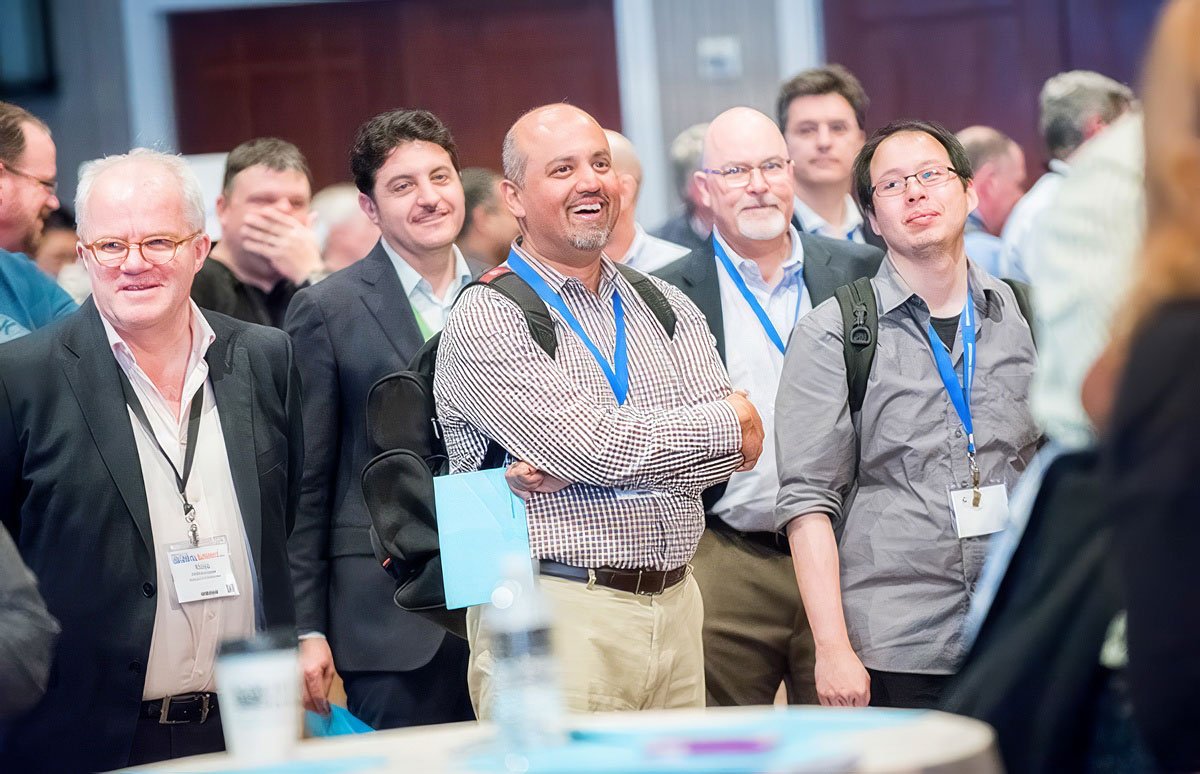 Group of people laughing and engaging at a corporate event in Boston.