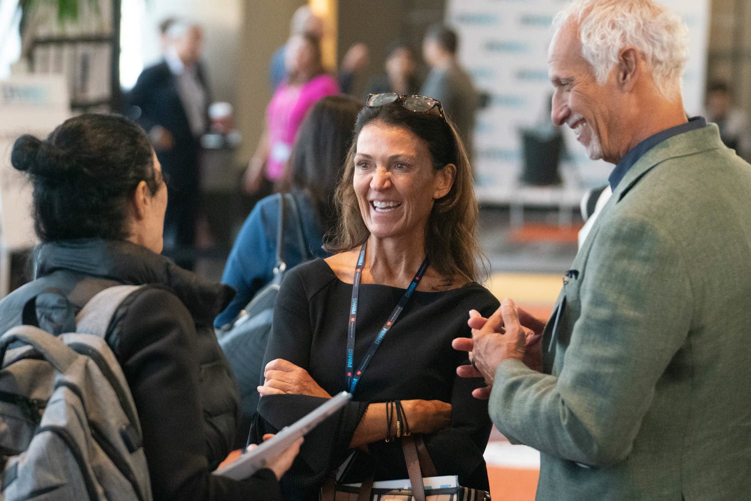 Conference attendees engaging in conversation in Boston.