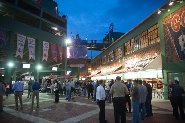 Crowd of people attending a corporate event at night
