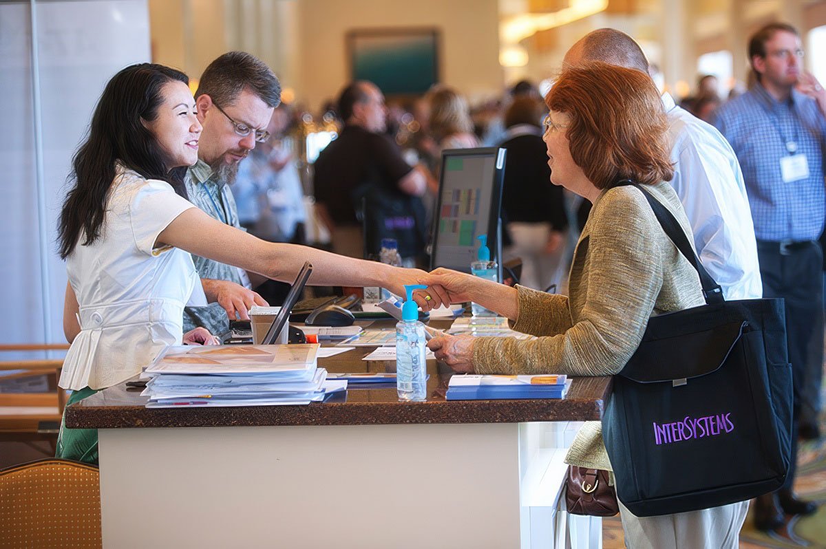 Corporate photographer Boston capturing an engaging interaction at a reception desk.