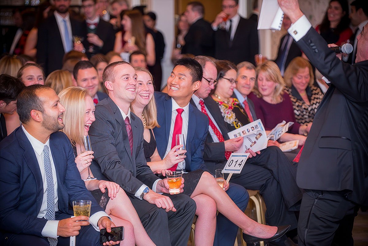 Group of attendees enjoying a corporate event in Boston, seated and engaged with a speaker.