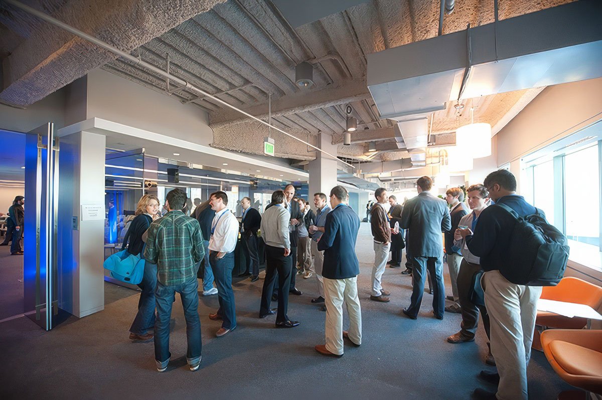 Group of people networking at a corporate event in Boston.