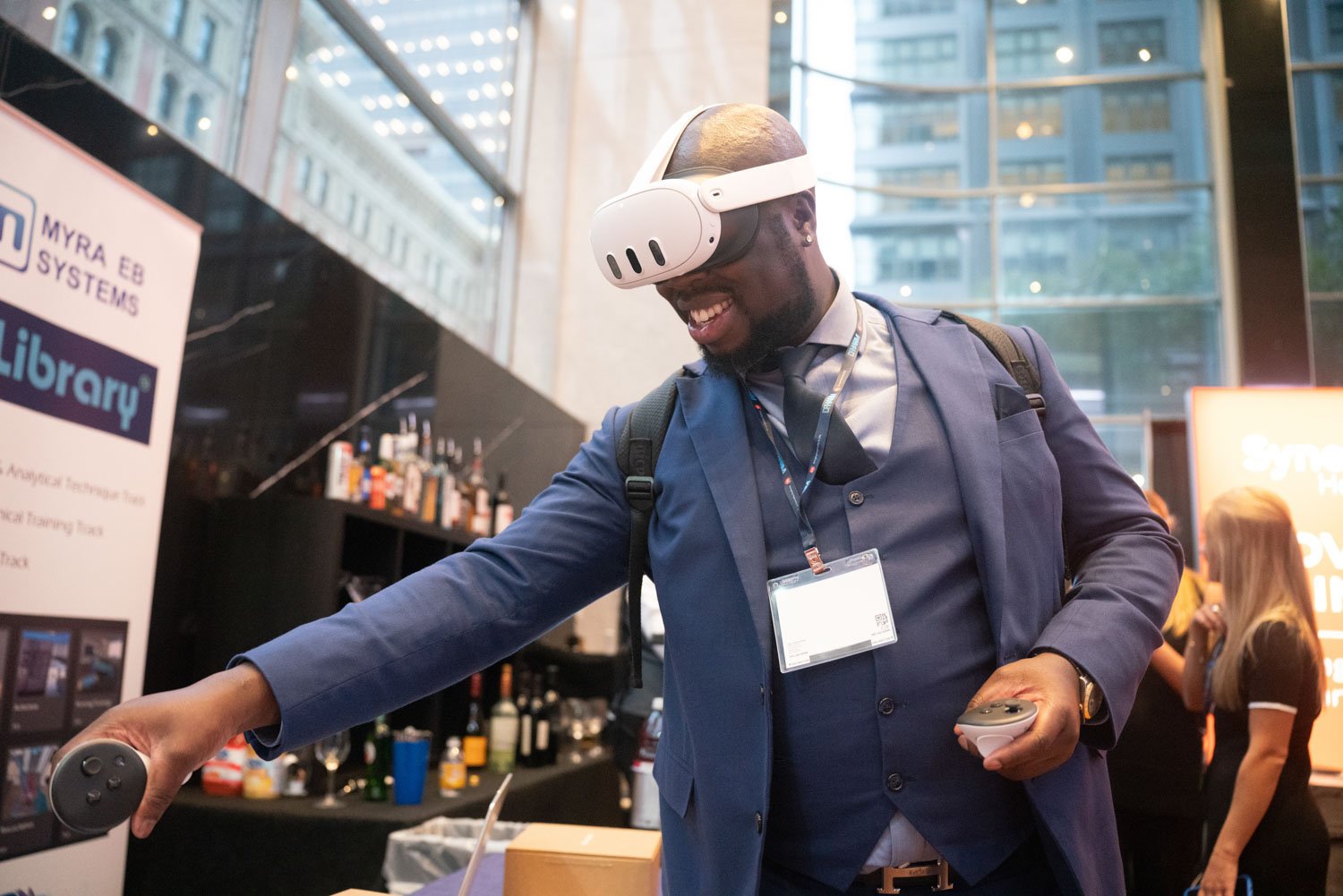 Man wearing a VR headset at a corporate event in Boston, engaging with technology.